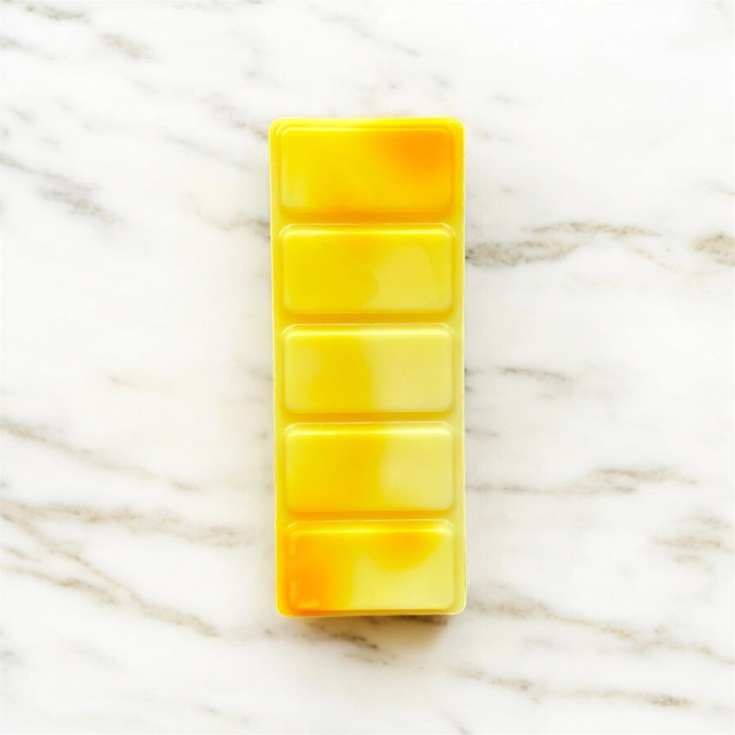 Yellow wax bar with a marbled background called sunshine