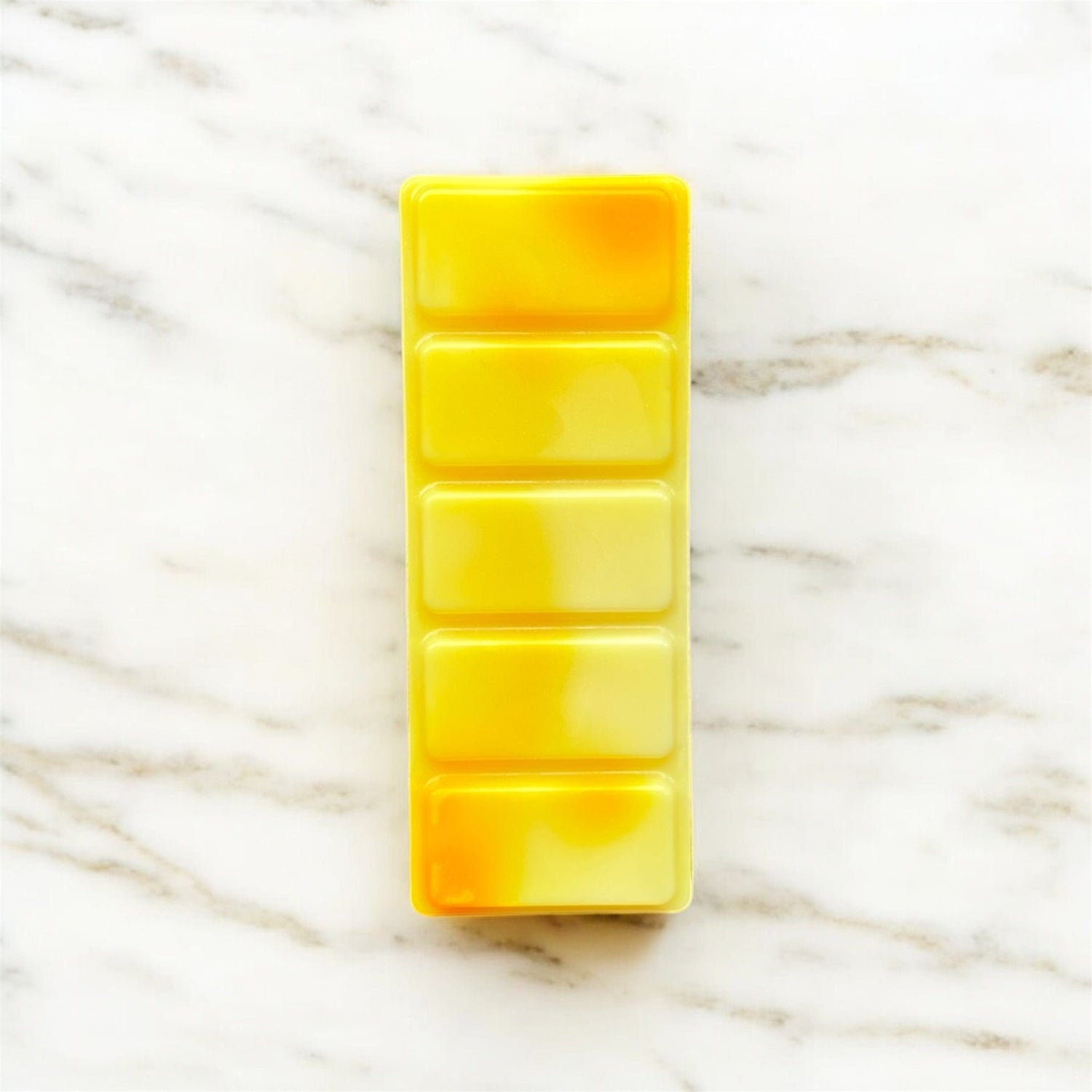Yellow wax bar with a marbled background called sunshine 